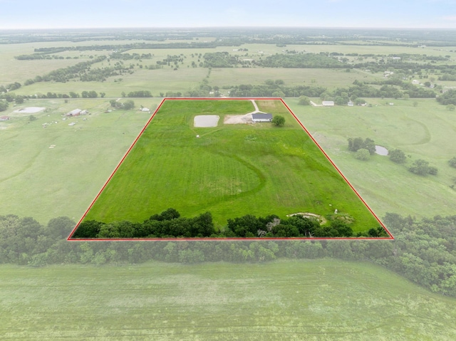 birds eye view of property with a rural view