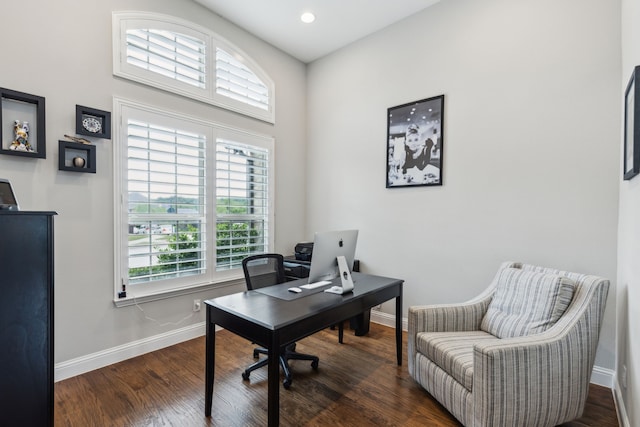 office space with baseboards and wood finished floors