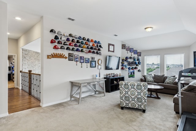 living room featuring carpet floors, baseboards, recessed lighting, and visible vents