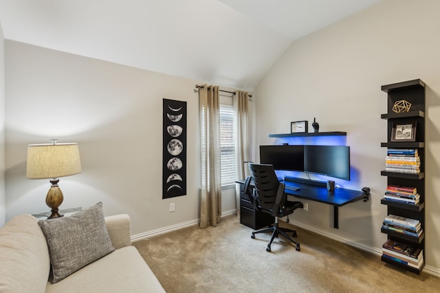 carpeted office with baseboards and lofted ceiling