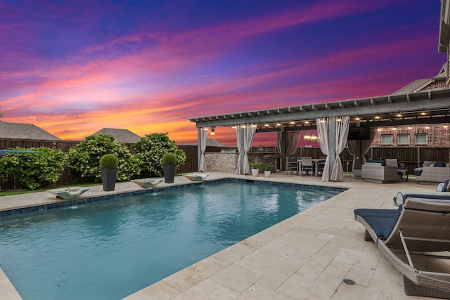pool at dusk featuring a pergola, a fenced backyard, an outdoor hangout area, a fenced in pool, and a patio area