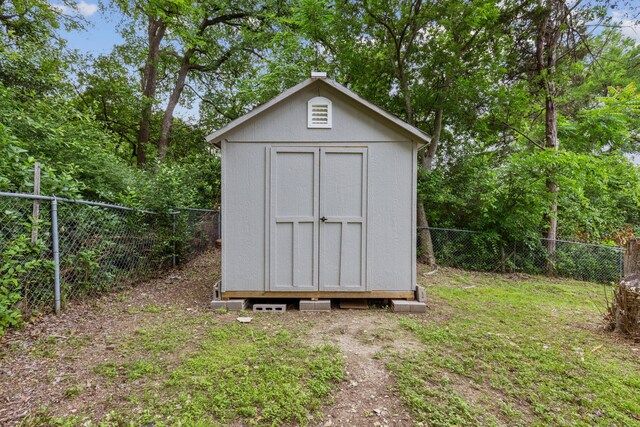 view of shed featuring a fenced backyard