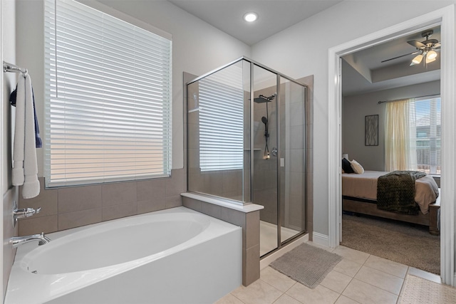 bathroom featuring tile patterned flooring, ensuite bathroom, a stall shower, and a bath