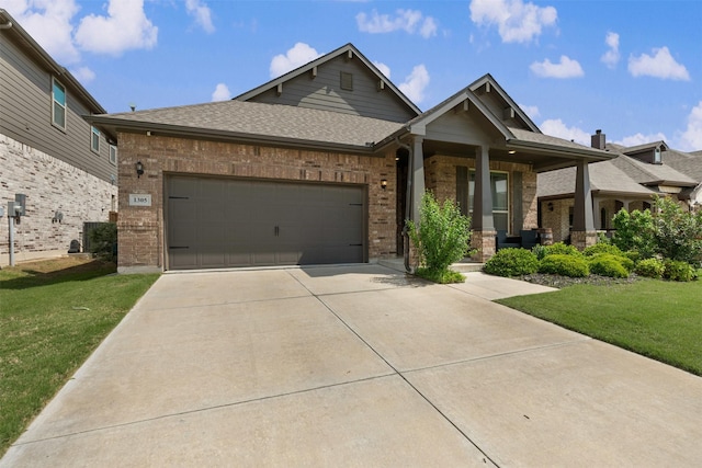 view of front facade with covered porch, driveway, a front yard, brick siding, and an attached garage