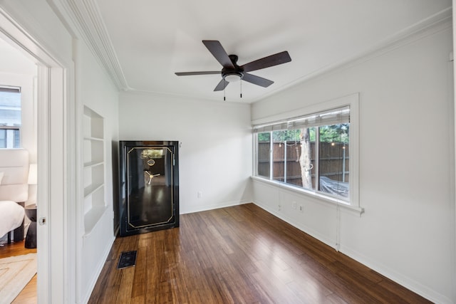 906 N Clinton Ave, Dallas, TX 75208 - unfurnished room with a ceiling fan, visible vents, dark wood finished floors, baseboards, and ornamental molding
