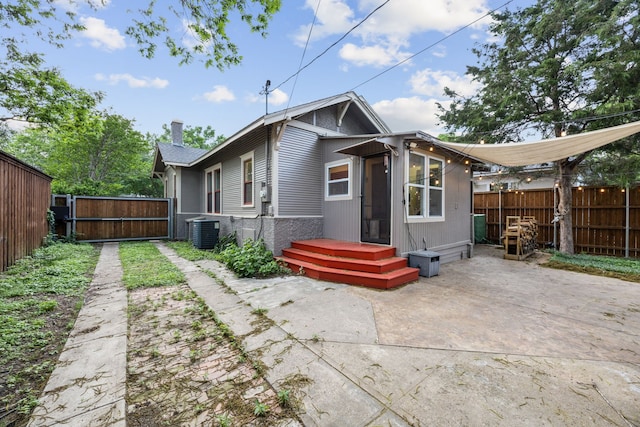 906 N Clinton Ave, Dallas, TX 75208 - rear view of house featuring a gate, a patio area, a fenced backyard, and cooling unit