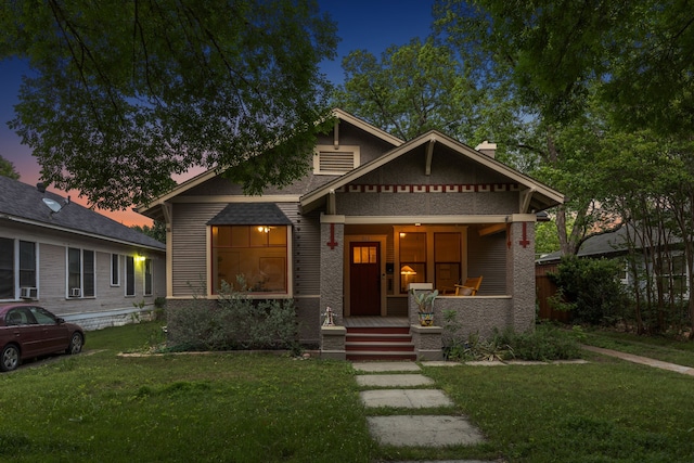 906 N Clinton Ave, Dallas, TX 75208 - view of front of home featuring a porch, a chimney, and a front lawn