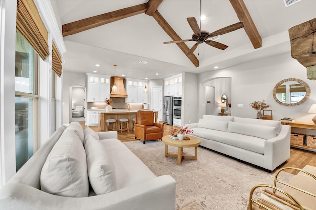 living area with recessed lighting, a ceiling fan, beam ceiling, and high vaulted ceiling