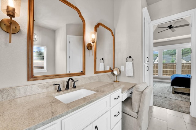 ensuite bathroom featuring tile patterned floors, ceiling fan, ensuite bathroom, and vanity