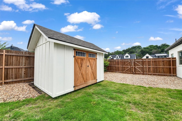view of shed featuring a fenced backyard