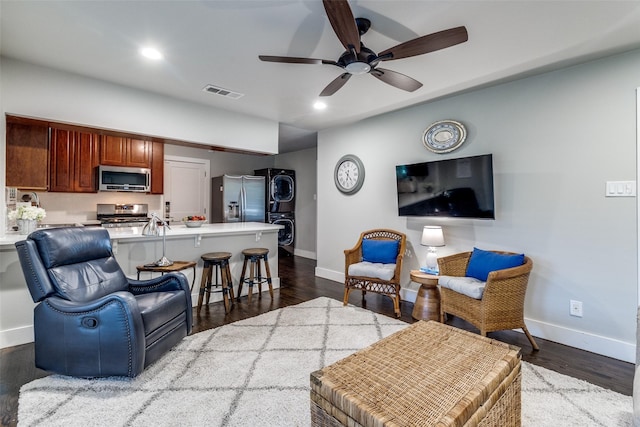 3158 Newcastle Dr, Dallas, TX 75220 - living area with visible vents, a ceiling fan, baseboards, and stacked washer / drying machine