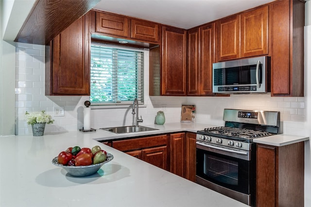 3158 Newcastle Dr, Dallas, TX 75220 - kitchen with brown cabinetry, tasteful backsplash, a sink, light countertops, and stainless steel appliances