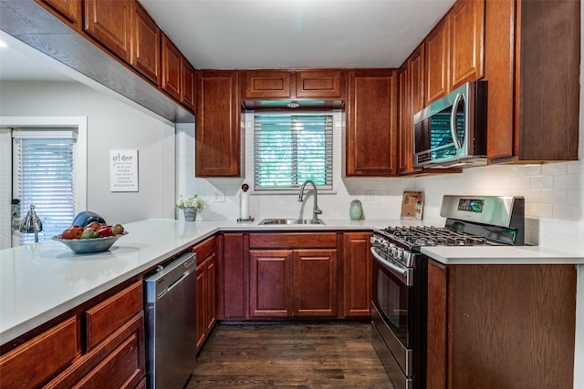 3158 Newcastle Dr, Dallas, TX 75220 - kitchen with dark wood-style flooring, light countertops, tasteful backsplash, a sink, and stainless steel appliances