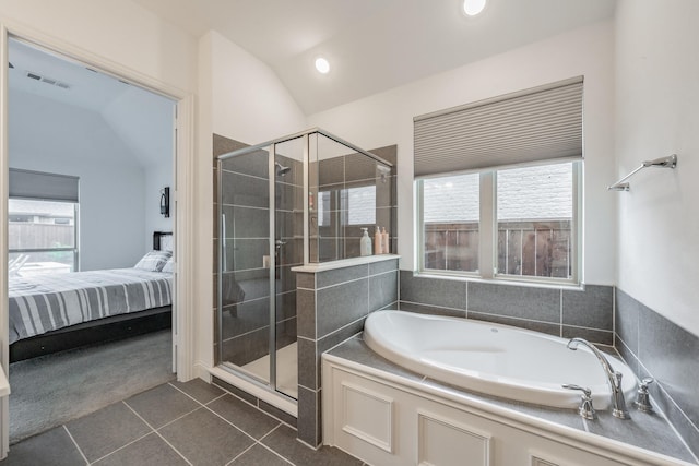 ensuite bathroom with visible vents, connected bathroom, tile patterned flooring, and a shower stall