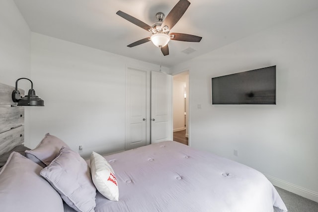 bedroom with baseboards, a ceiling fan, and visible vents