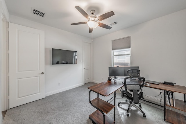 office area featuring baseboards, a ceiling fan, carpet floors, and visible vents