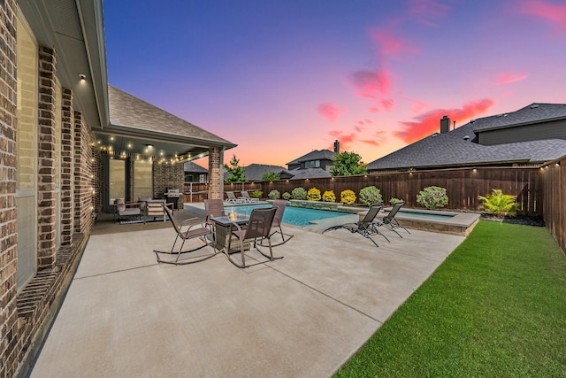 view of swimming pool featuring a yard, a patio, a fenced in pool, and a fenced backyard