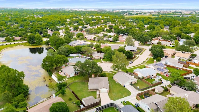 drone / aerial view with a water view and a residential view