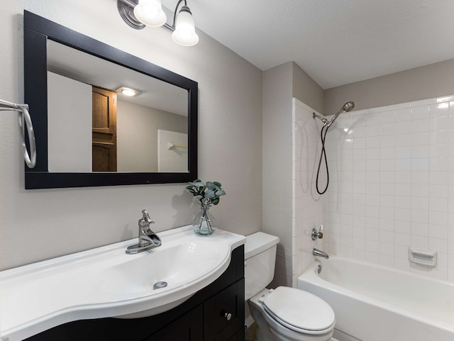 full bathroom featuring toilet, a textured ceiling, shower / bathing tub combination, and vanity