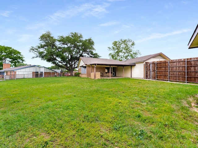 view of yard featuring fence