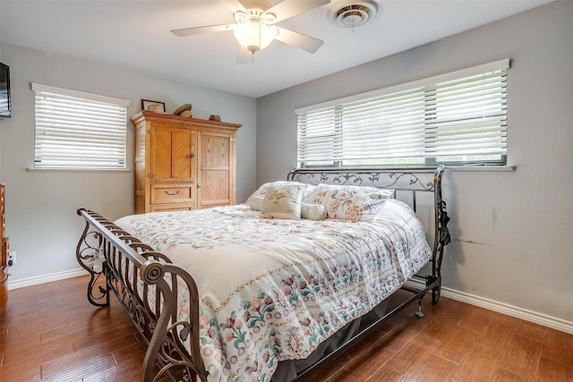 bedroom with baseboards, ceiling fan, and wood finished floors