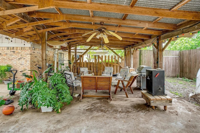 view of patio featuring a grill, a fenced backyard, an outdoor hangout area, a ceiling fan, and a gazebo