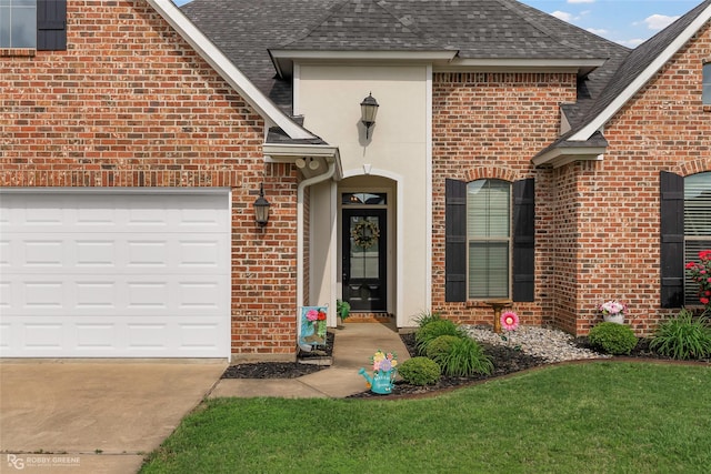 property entrance with roof with shingles, a garage, driveway, and brick siding