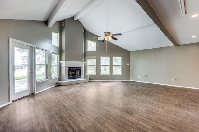 2400 N Shore Dr, Bonham, TX 75418 - unfurnished living room featuring ceiling fan, beam ceiling, high vaulted ceiling, and wood finished floors