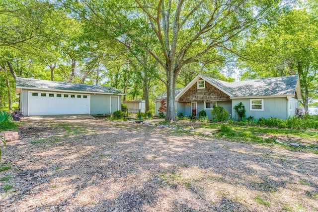 2400 N Shore Dr, Bonham, TX 75418 - ranch-style home with an outdoor structure and driveway