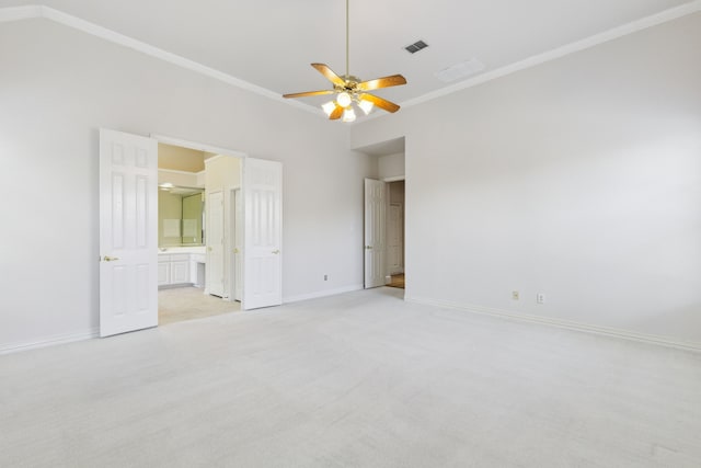 unfurnished bedroom featuring visible vents, ornamental molding, baseboards, and light carpet