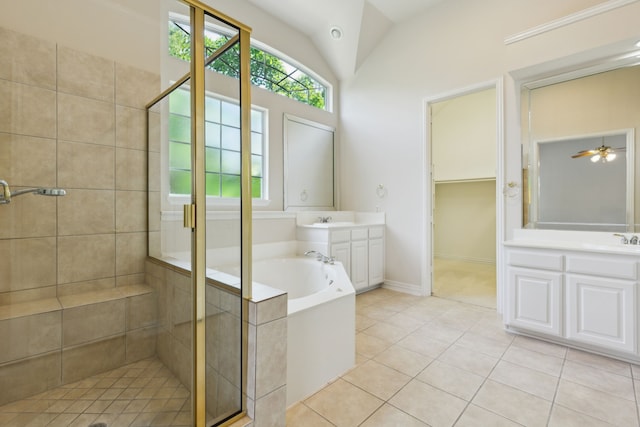full bath featuring a sink, tile patterned flooring, a shower stall, and a garden tub