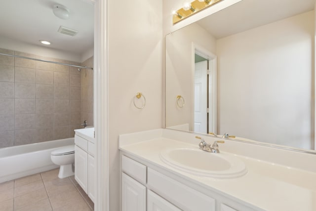 bathroom featuring visible vents, tile patterned flooring, vanity, toilet, and bathing tub / shower combination