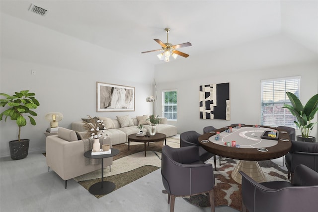 living room featuring a healthy amount of sunlight, ceiling fan, vaulted ceiling, and visible vents