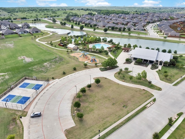 bird's eye view with a water view and a residential view