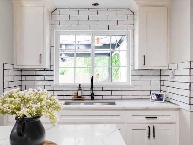 1821 Melissa St, Arlington, TX 76010 - kitchen featuring a sink, a healthy amount of sunlight, and tasteful backsplash
