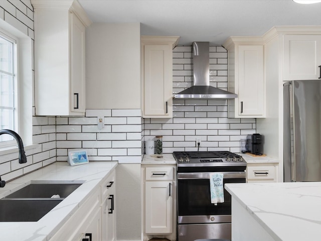 1821 Melissa St, Arlington, TX 76010 - kitchen with wall chimney range hood, appliances with stainless steel finishes, light stone counters, a sink, and backsplash