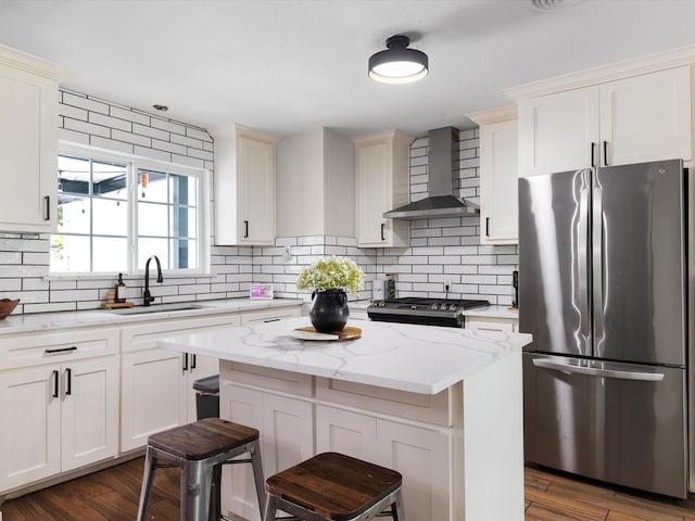 1821 Melissa St, Arlington, TX 76010 - kitchen with backsplash, a center island, a sink, stainless steel appliances, and wall chimney exhaust hood
