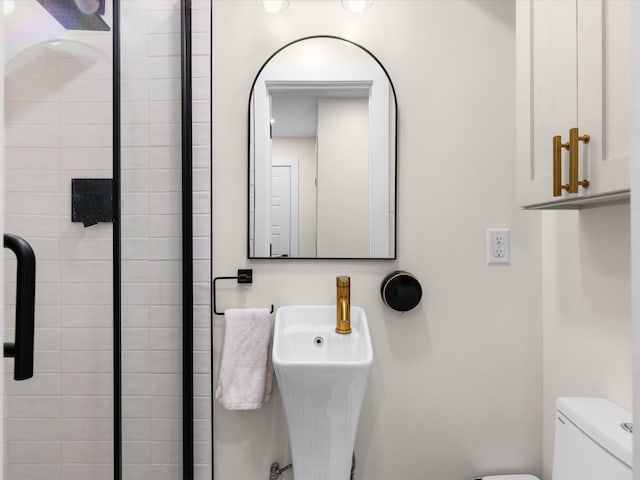 1821 Melissa St, Arlington, TX 76010 - bathroom with a sink, toilet, and a shower stall