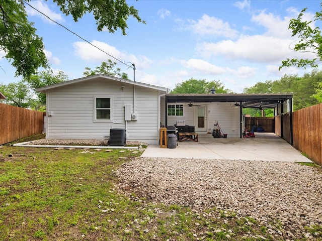 1821 Melissa St, Arlington, TX 76010 - back of property with a patio, a fenced backyard, ceiling fan, and cooling unit