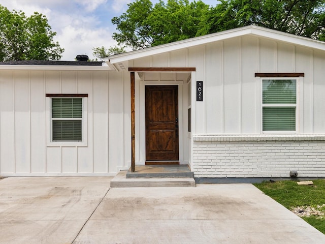 1821 Melissa St, Arlington, TX 76010 - entrance to property featuring brick siding and board and batten siding