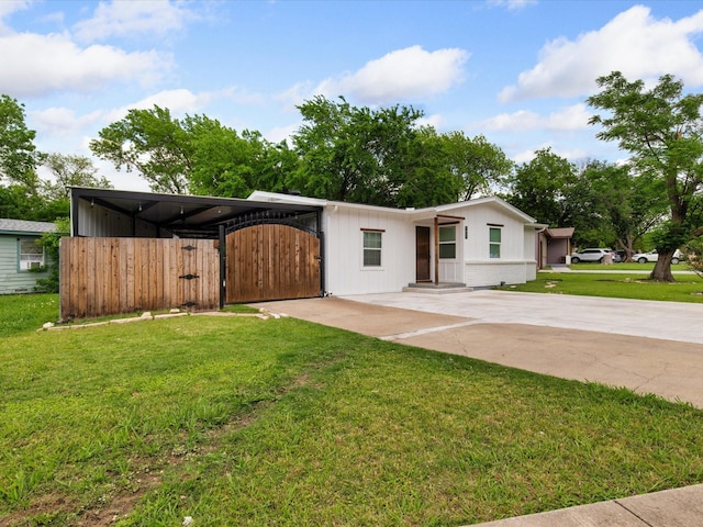 1821 Melissa St, Arlington, TX 76010 - view of front facade featuring a front lawn, fence, a gate, driveway, and a carport