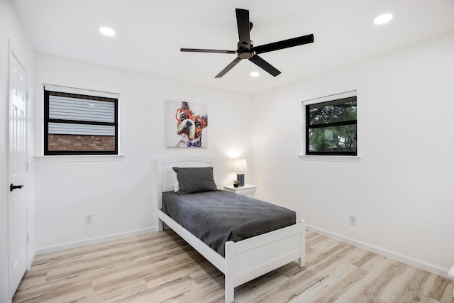 bedroom featuring recessed lighting, baseboards, ceiling fan, and wood finished floors