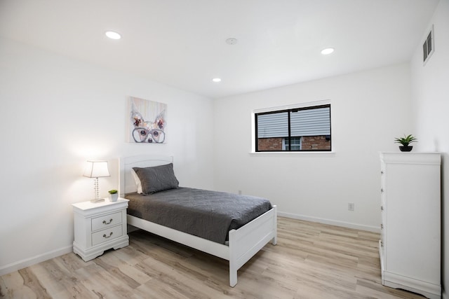 bedroom featuring recessed lighting, baseboards, light wood-type flooring, and visible vents