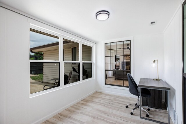 office area featuring baseboards and wood finished floors