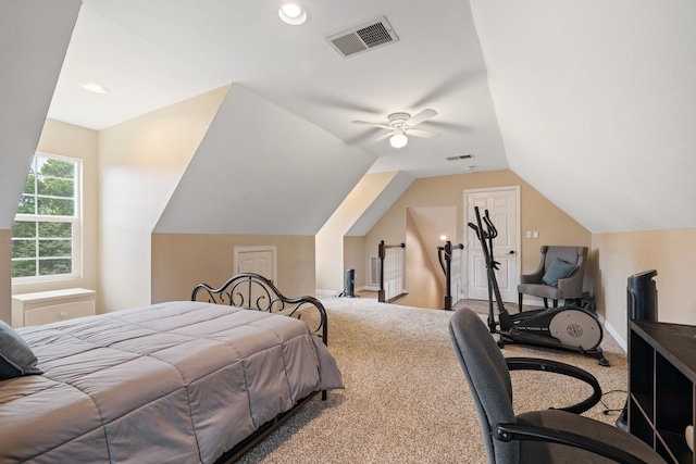 bedroom with carpet floors, a ceiling fan, vaulted ceiling, and visible vents