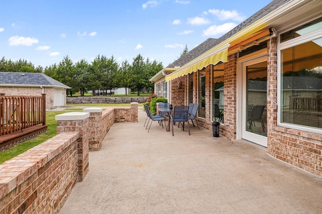view of patio with outdoor dining area