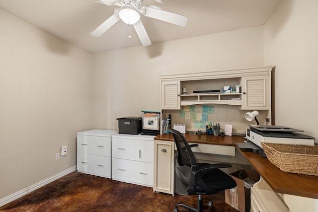 office space featuring baseboards, concrete floors, and ceiling fan