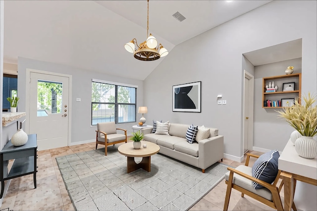 living area with a notable chandelier, high vaulted ceiling, baseboards, light tile patterned floors, and visible vents