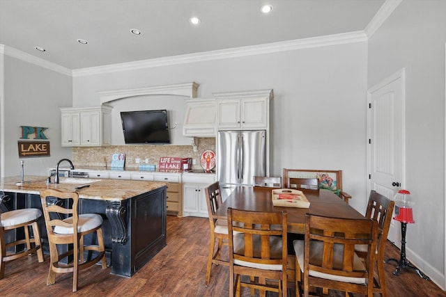 kitchen featuring crown molding, freestanding refrigerator, and dark wood-type flooring