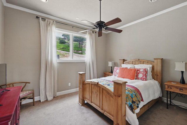 bedroom featuring light colored carpet, ornamental molding, baseboards, and ceiling fan